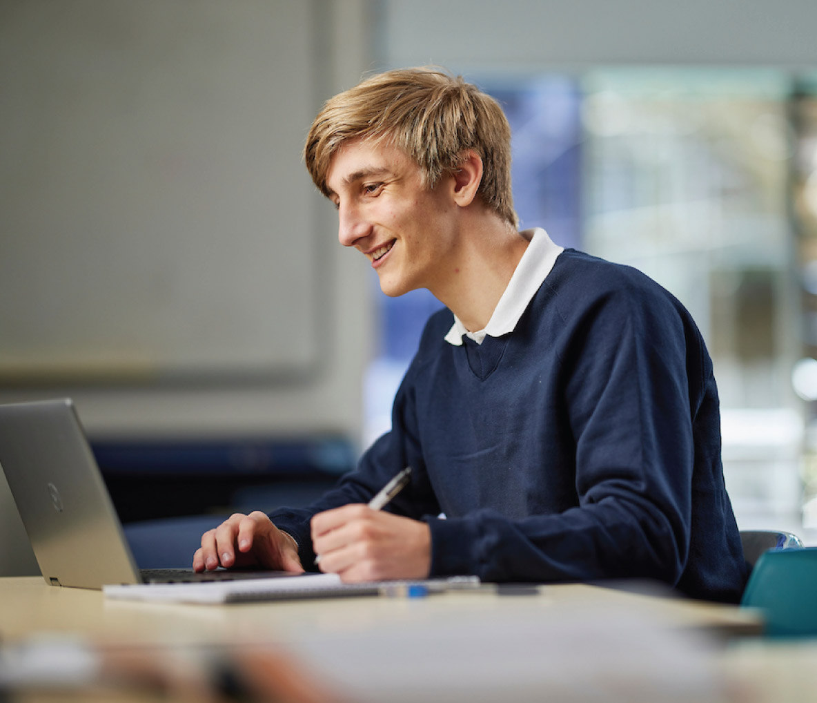 Smith Family male student sitting at desk